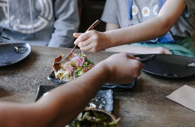 Close up of diners eating at SUPER.