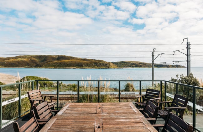 A view of the ocean from an outdoor balcony.