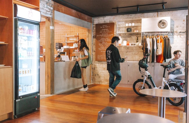 Interior of Swings Auckland where a lady is ordering at the counter.