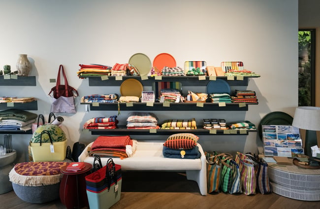 Vibrant shelves full of homeware at Swoon Store.