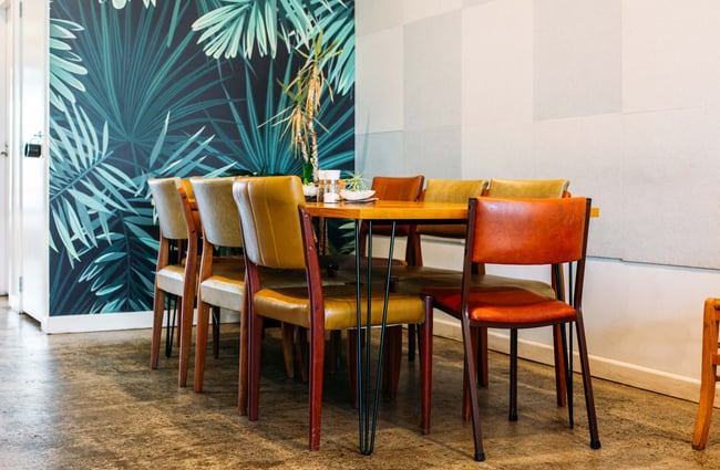 Vintage chairs around a table at t bay cafe, Porirua.