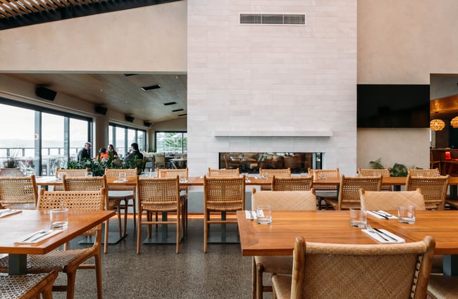 Seating and a fireplace inside Tahu Gisborne.