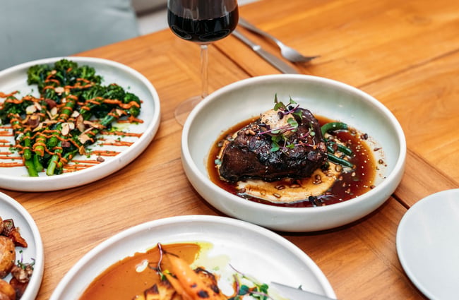 Plates of food on a table at Tahu Gisborne.
