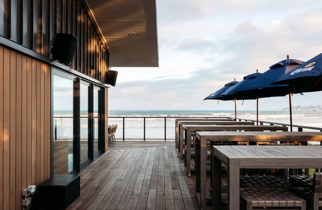 Outdoor seating on a deck at Tahu Gisborne.
