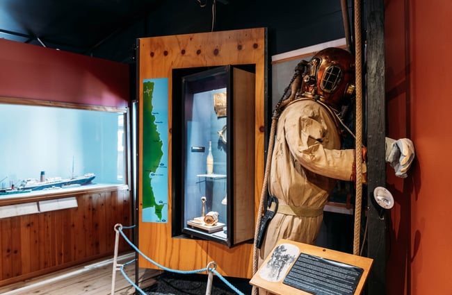An exhibition of a scuba diver inside a muesum.