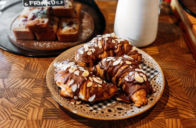 A plate of chocolate almond croissants on the counter at Taper.