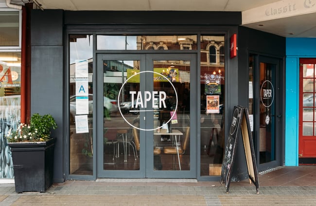 Glass exterior doors to Taper Eatery.