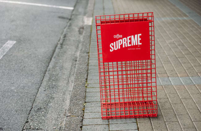 Supreme coffee signage outside Taper.