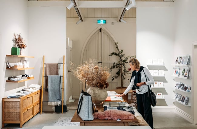 Customer picking up an item in a store at Tarras Village.