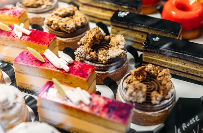 Close up of award-winning French patisserie in cafe cabinet
