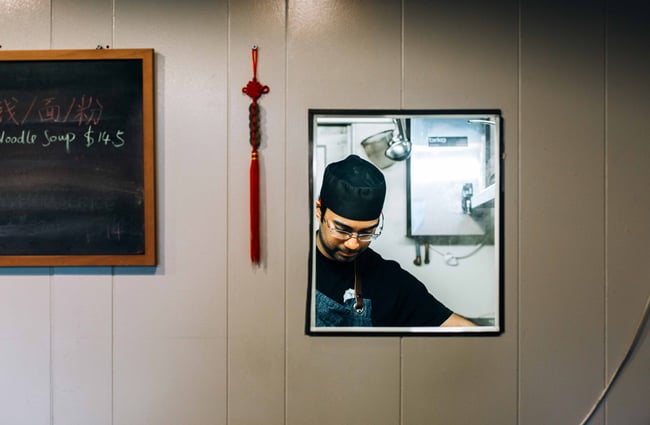 Chef working through a small window.