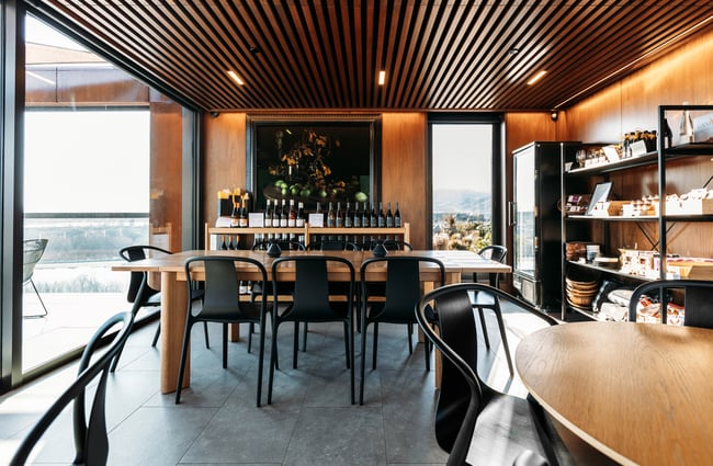Tables and chairs inside a winery restaurant in Central Otago.