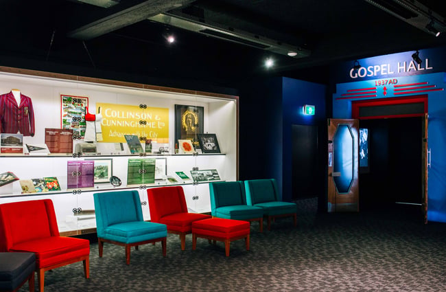 A replica hall filled with lots of different coloured chairs.