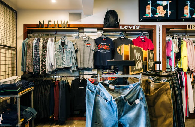 Apparel on racks.