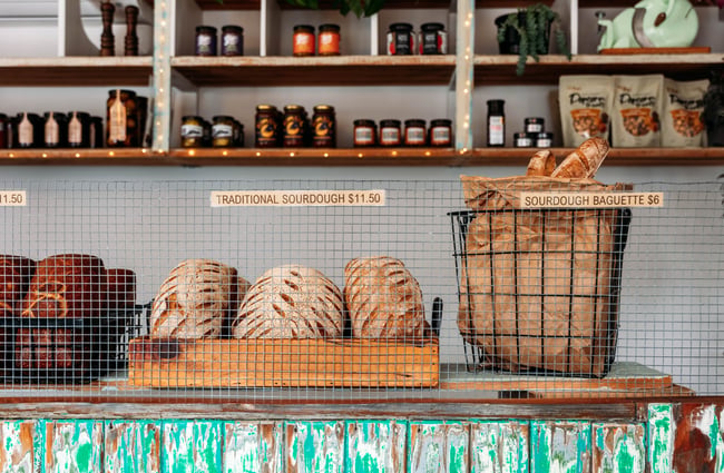 Baskets of bread on the counter at The Baked Dane.