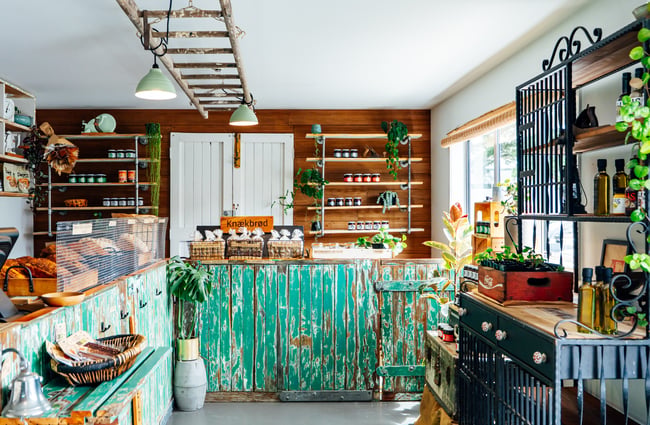 Bakery front counter with green frontage at The Baked Dane.