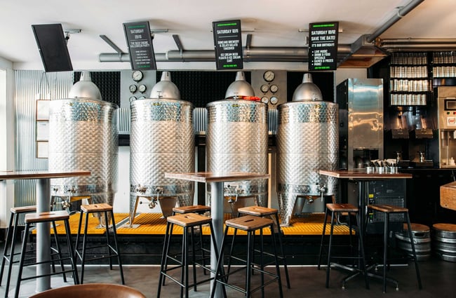 Four big silver brewery silos inside the Beer Engine brewery.