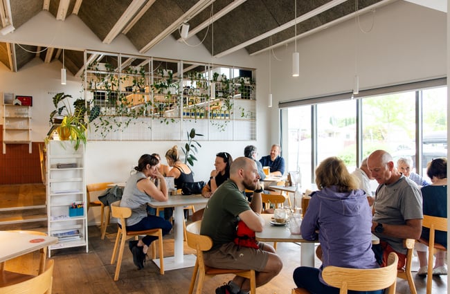Customers sitting at tables in The Birdwood.