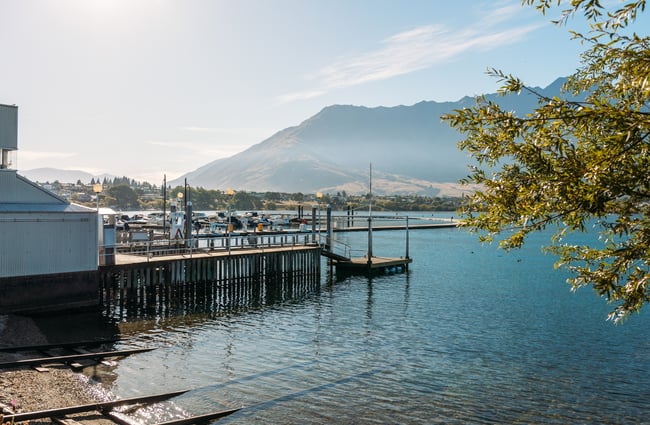 A jetty on a lake on a sunny day.