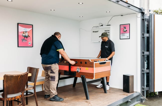 Cutomers playing on the foozeball table at The Bond Store.