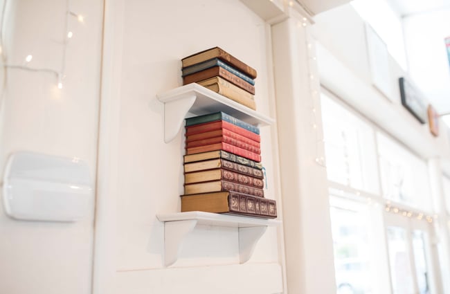Books on a white bookshelf.