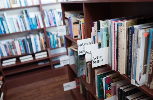 Labels for books on the shelves.