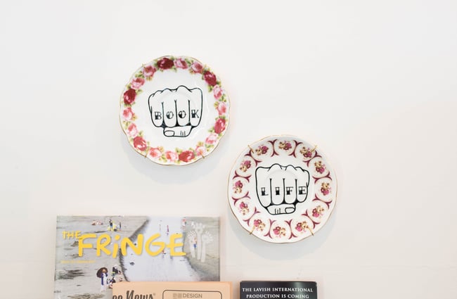 Book Life plates on the wall.