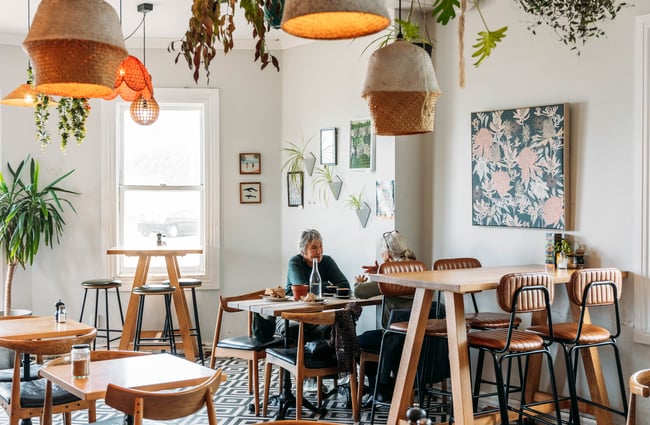 Two people sitting at a cafe.