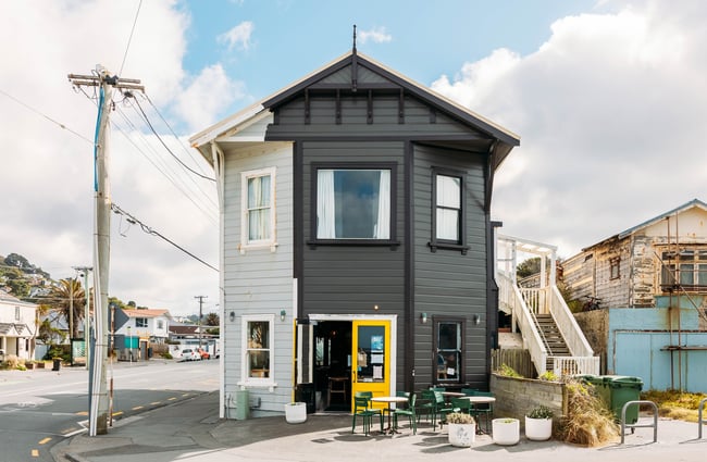 The black exterior of The Botanist in Lyall Bay/