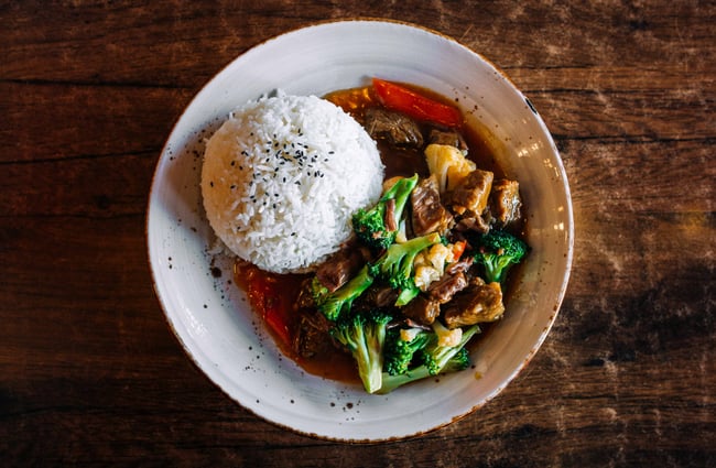 Stir fry beef and rice on a plate.