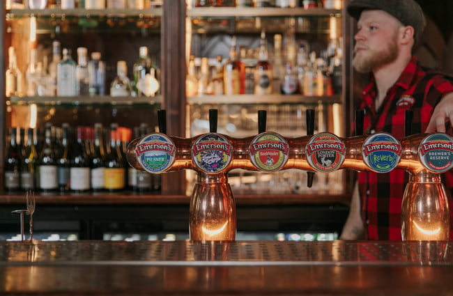 A close up of Emerson beer taps.