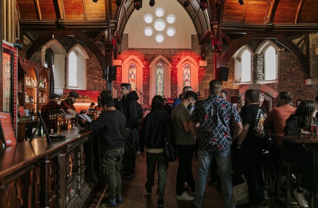 Customers standing around inside the Church Pub.