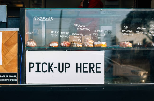 Donuts on display in the cabinet in the food truck.