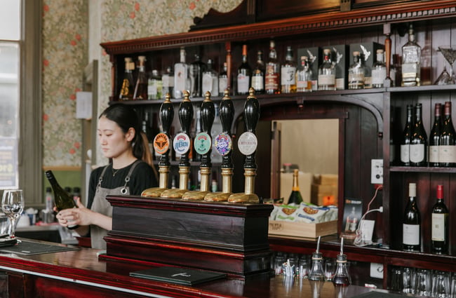 A staff member working behind the bar.