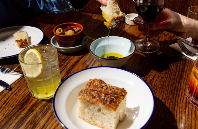 Table of wine and focaccia at Bar Franco at The Crossing in Christchurch