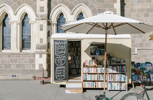 The little yellow exterior of The Custard Square Bookshop outside Christchurch Arts Centre.