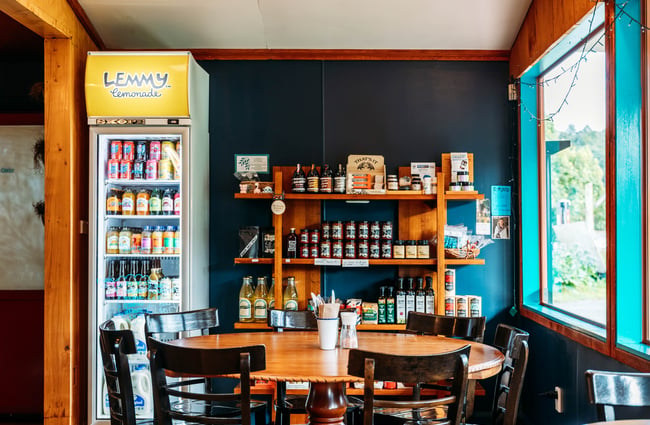 A round table and seats inside The Duke’s Roadhouse in Rangitikei.