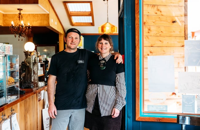 A woman and woman smiling to camera inside The Duke’s Roadhouse in Rangitikei.