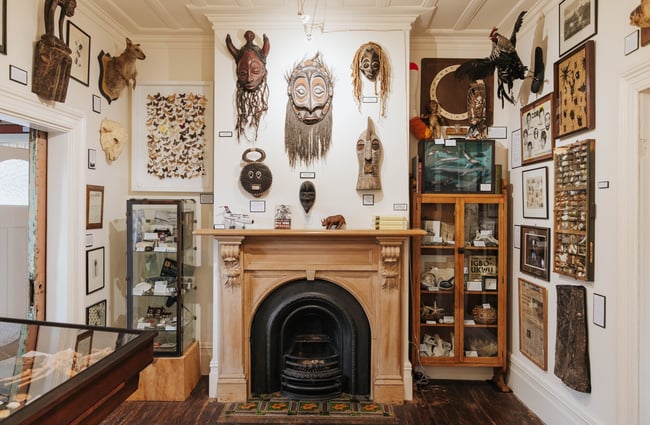 Works of mystery above a fireplace.