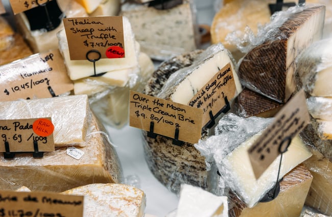 Close up of a specialty range of cut cheeses