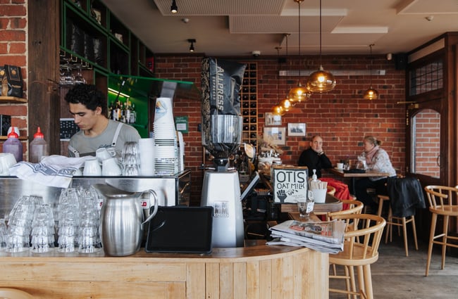 A staff member working behind the counter.