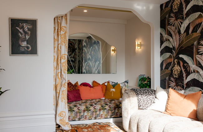 Patterned sofas in the living room at The Eve Apartment.