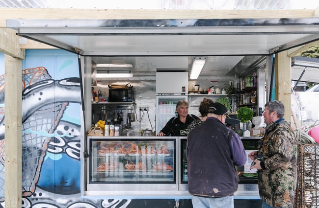 The FishWife counter with customers being served in Moeraki.