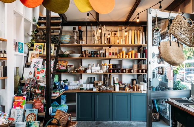 Products on display on shelves in the shop at The Flower Crate.