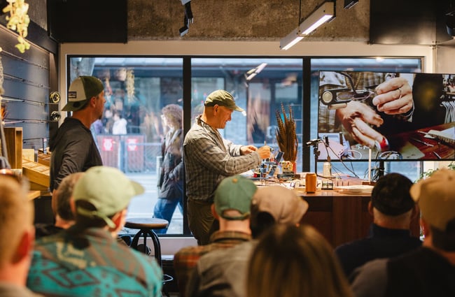 A man working on a flay at Patagonia's Fly Bar in Queenstown.