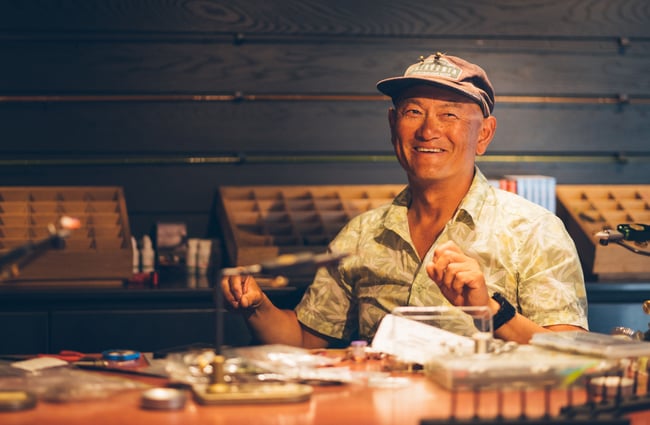 A man laughing inside Patagonia's Fly Bar in Queenstown.