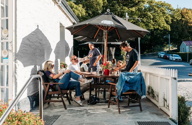 People dining outside on a sunny day.