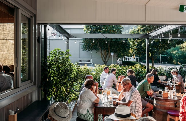 Customers dining outside at The Fork and Tap in Arrowtown.
