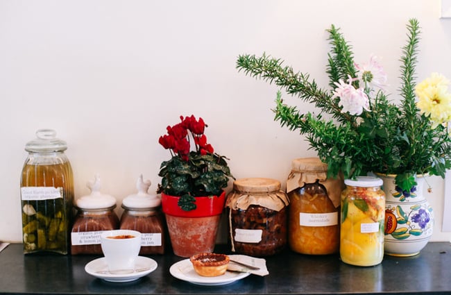 Chutneys and coffee on a counter.