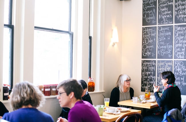 Inside tables by the windows and blackboards.
